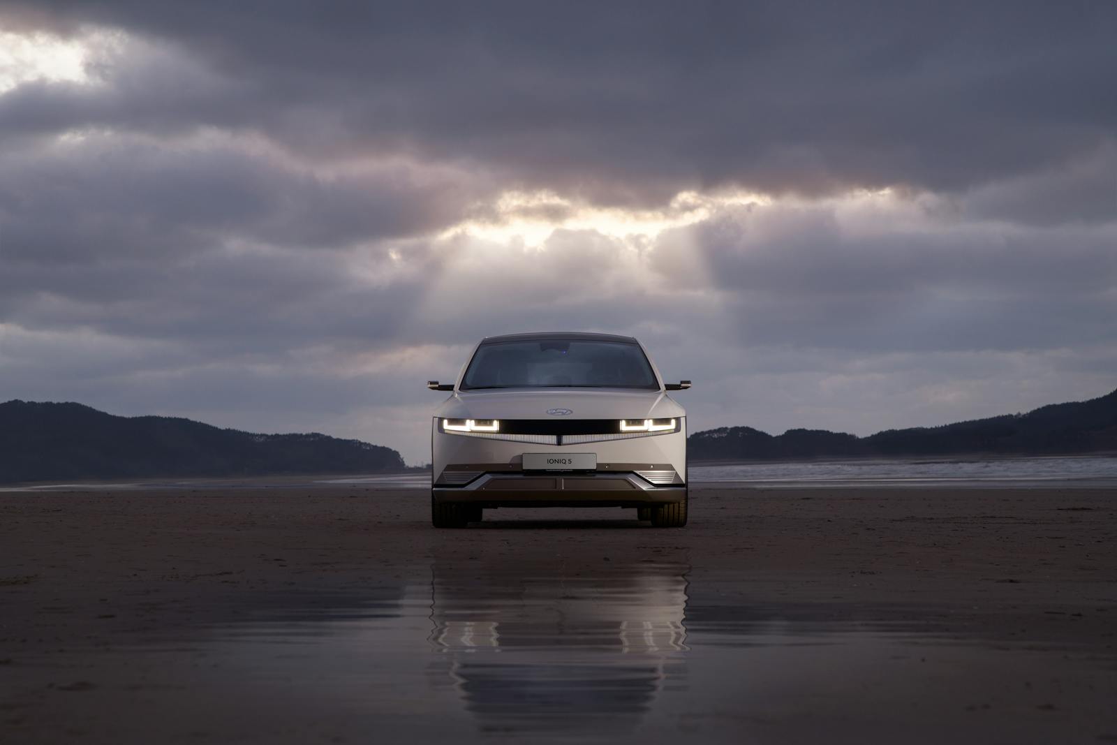 Front View of White Hyundai Car on Wet Road